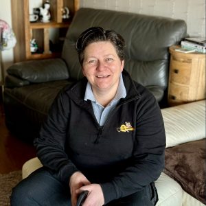 smiling female locksmith in Exmouth
